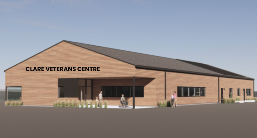 An image of the rendering drawing of the future Clare Veterans Centre. A rectangular shape building with wood finish. 
