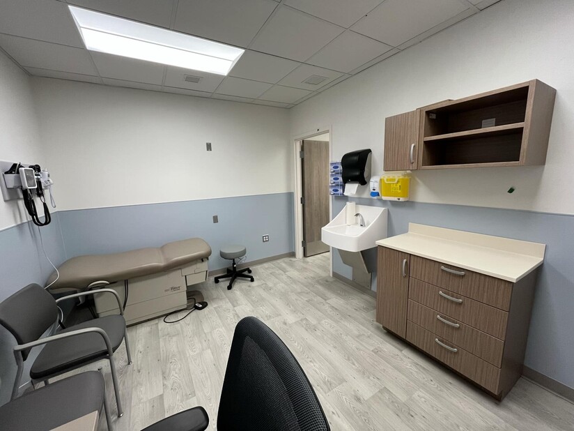 Three images of the Clare Health Centre expansion including an exam room, the exterior of the building and a new administrative space.